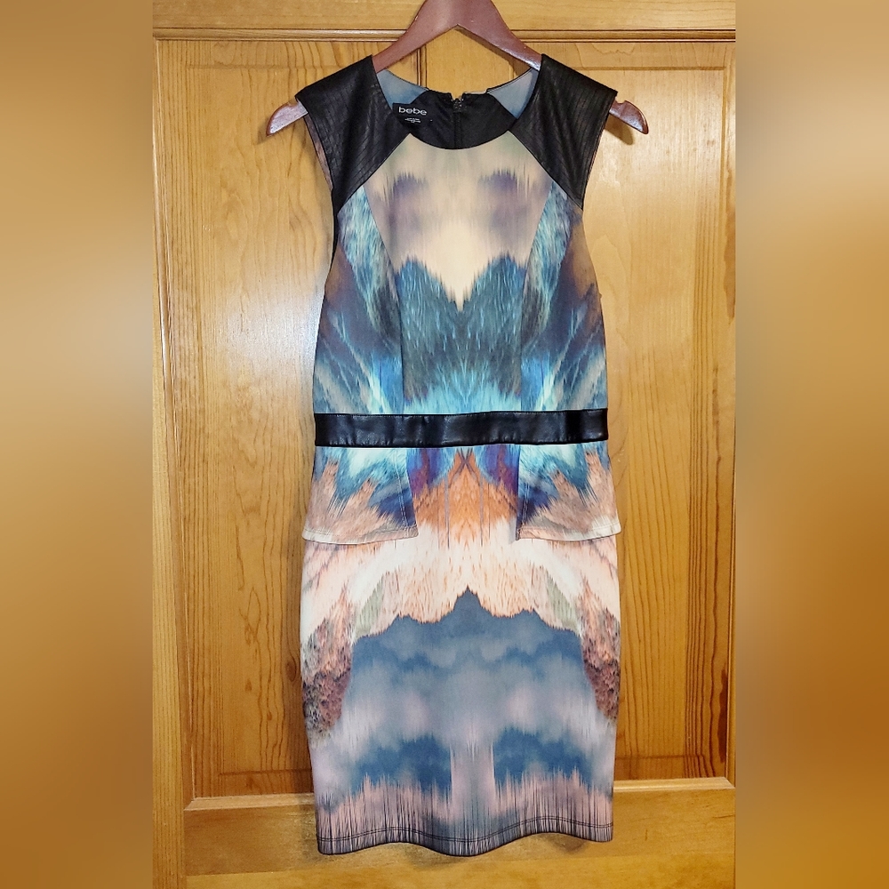 Bebe Watercolor Black Peplum Dress with Faux Leather Accents. Size Medium